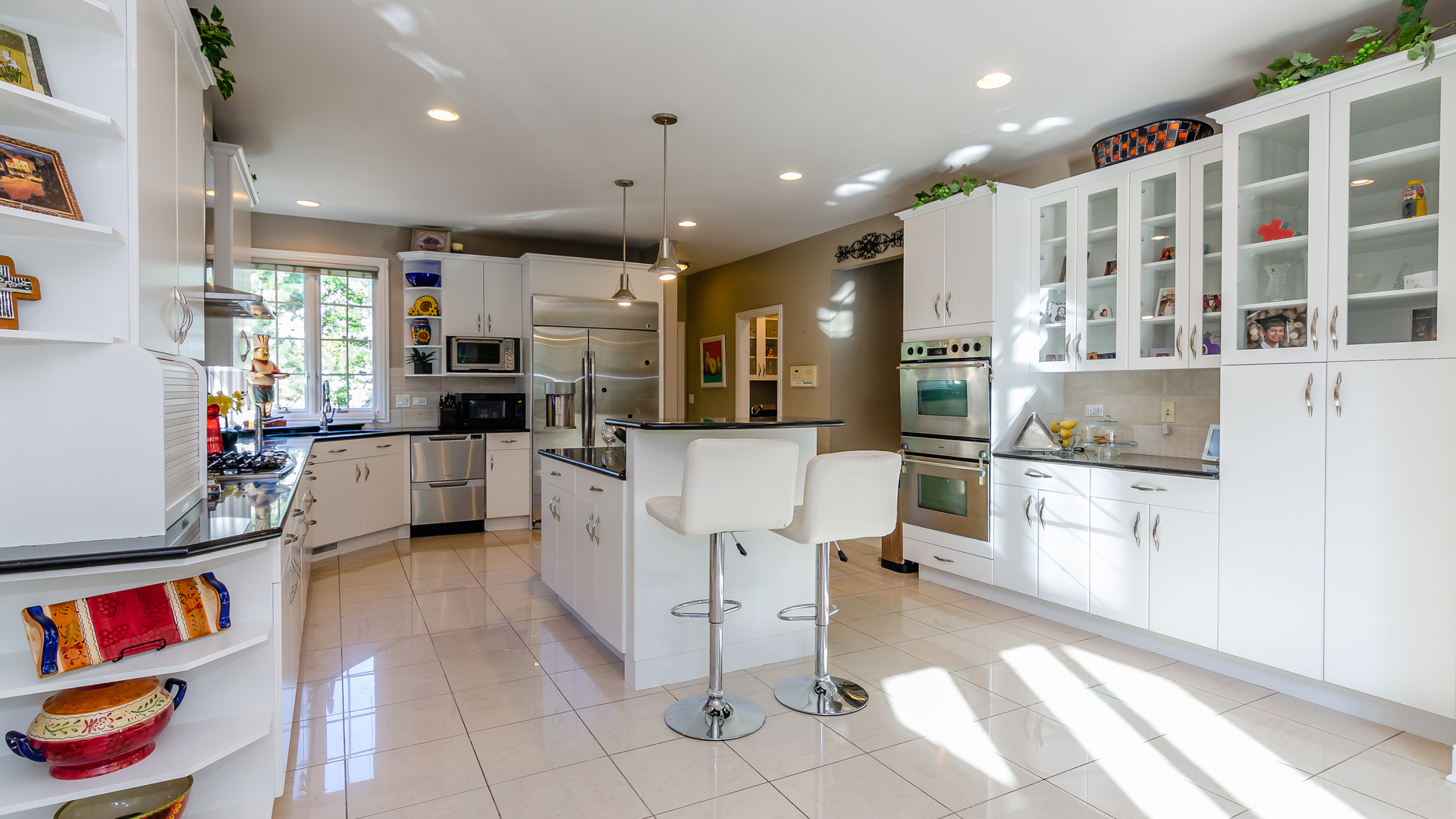 6919 Fieldstone Drive Burr Ridge, IL 60527 - Photo 15 of 58 a kitchen with a refrigerator and a sink