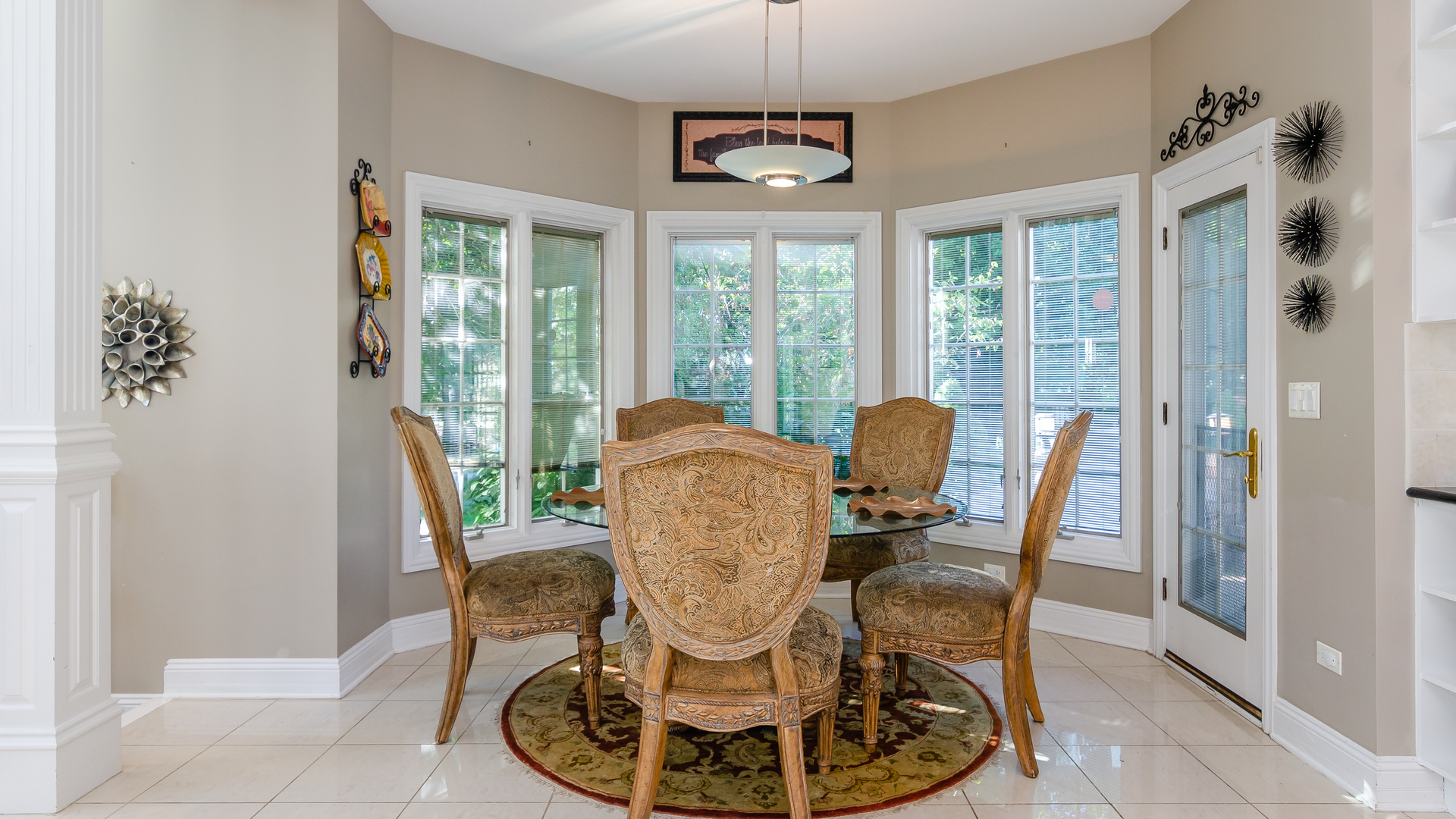 6919 Fieldstone Drive Burr Ridge, IL 60527 - Photo 18 of 58 a dining room with furniture a chandelier and wooden floor