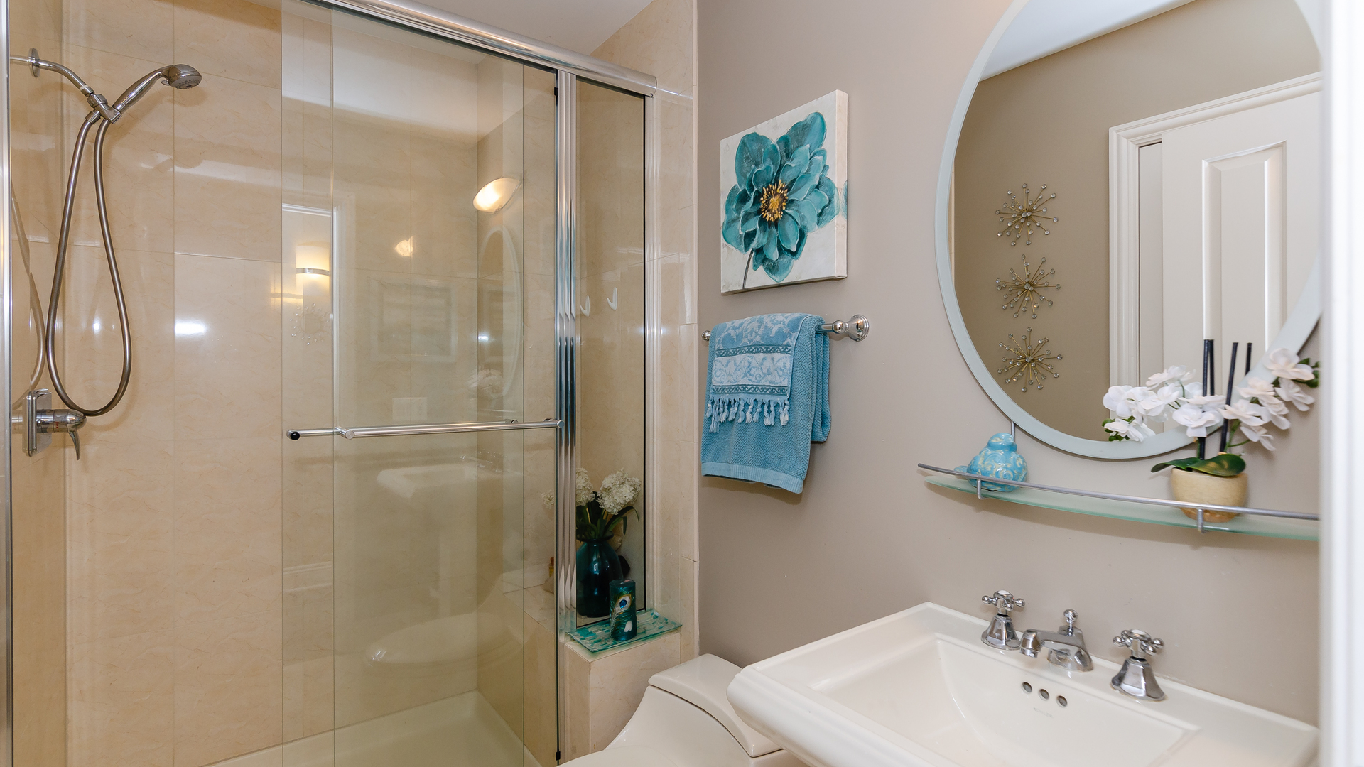 6919 Fieldstone Drive Burr Ridge, IL 60527 - Photo 22 of 58 a bathroom with a sink a mirror and a shower
