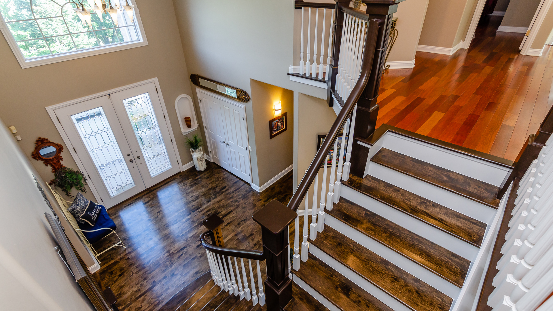 6919 Fieldstone Drive Burr Ridge, IL 60527 - Photo 24 of 58 a view of an entryway with wooden floor and stairs