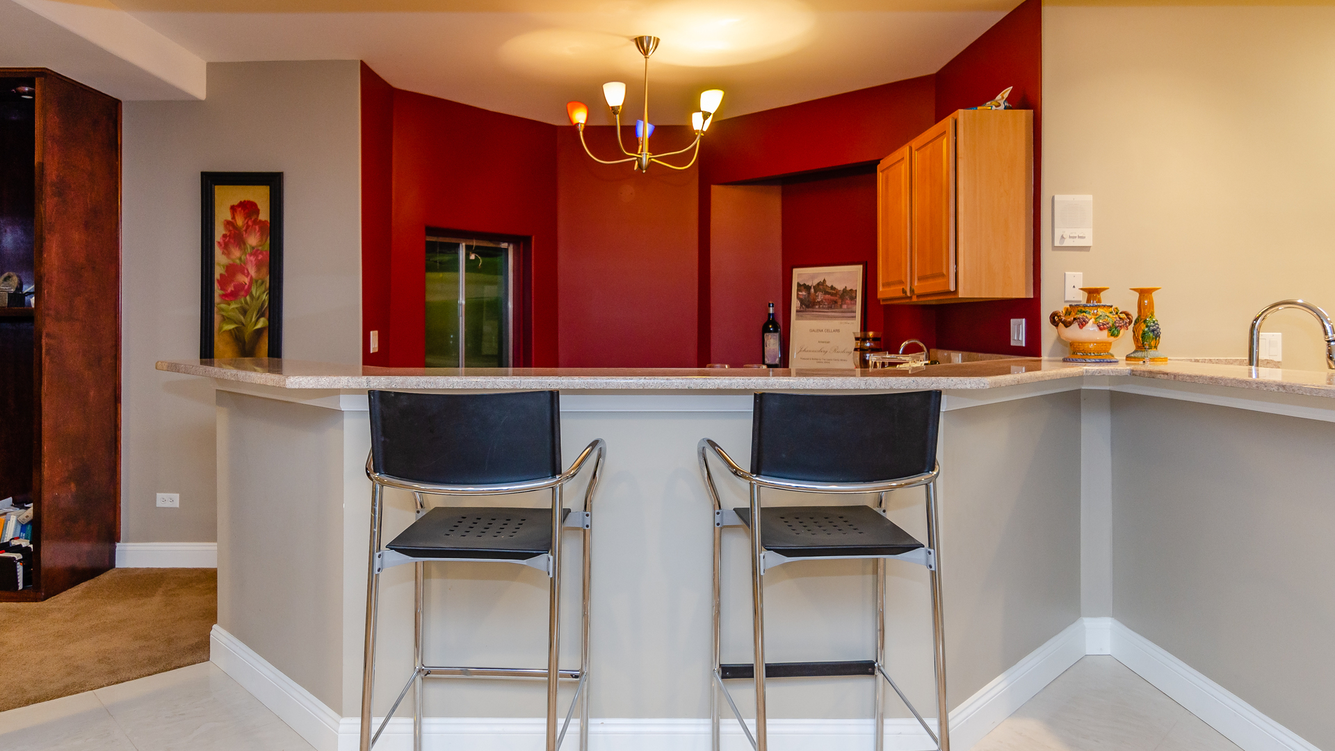 6919 Fieldstone Drive Burr Ridge, IL 60527 - Photo 41 of 58 a kitchen with stainless steel appliances a dining table and chairs