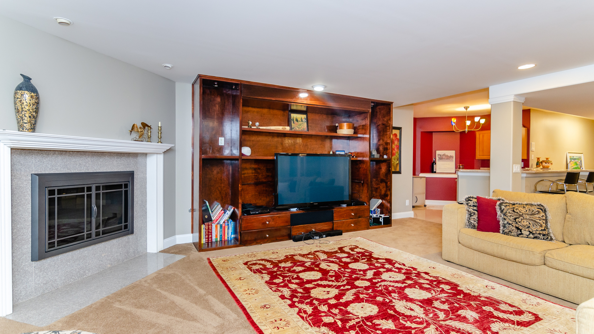 6919 Fieldstone Drive Burr Ridge, IL 60527 - Photo 43 of 58 a living room with furniture a flat screen tv and a fireplace