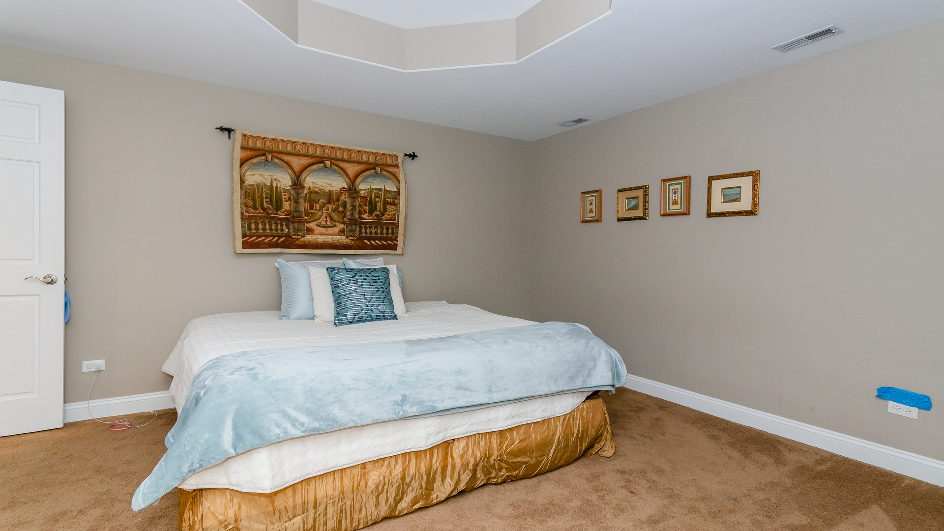 6919 Fieldstone Drive Burr Ridge, IL 60527 - Photo 47 of 58 a bedroom with a bed and painting on the wall