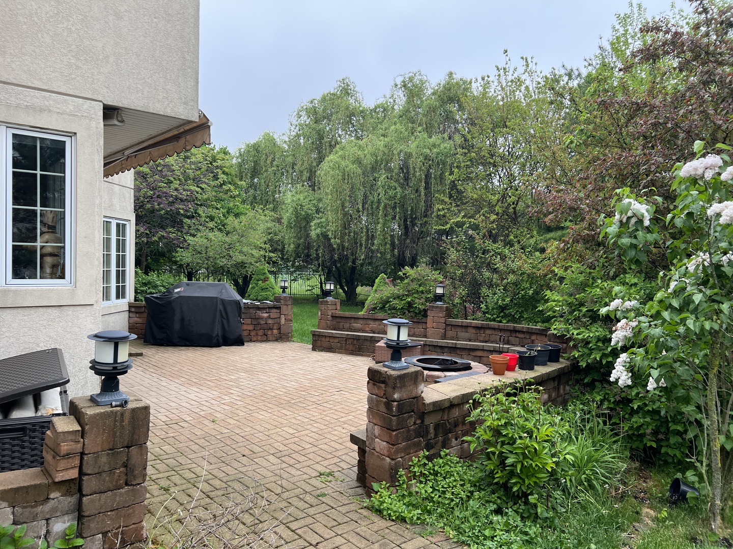 6919 Fieldstone Drive Burr Ridge, IL 60527 - Photo 50 of 58 a view of a backyard with sitting area and furniture