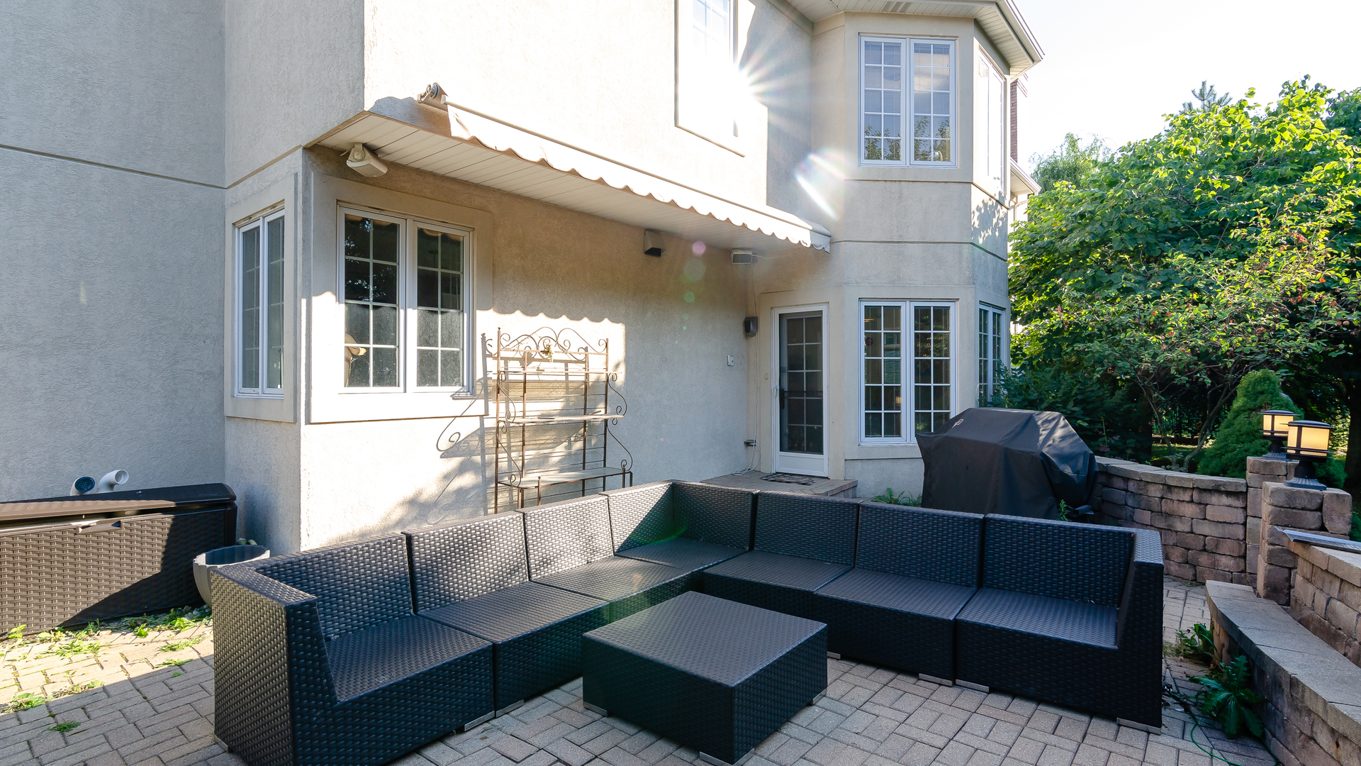 6919 Fieldstone Drive Burr Ridge, IL 60527 - Photo 51 of 58 a view of a patio with couches and a potted plant on a table