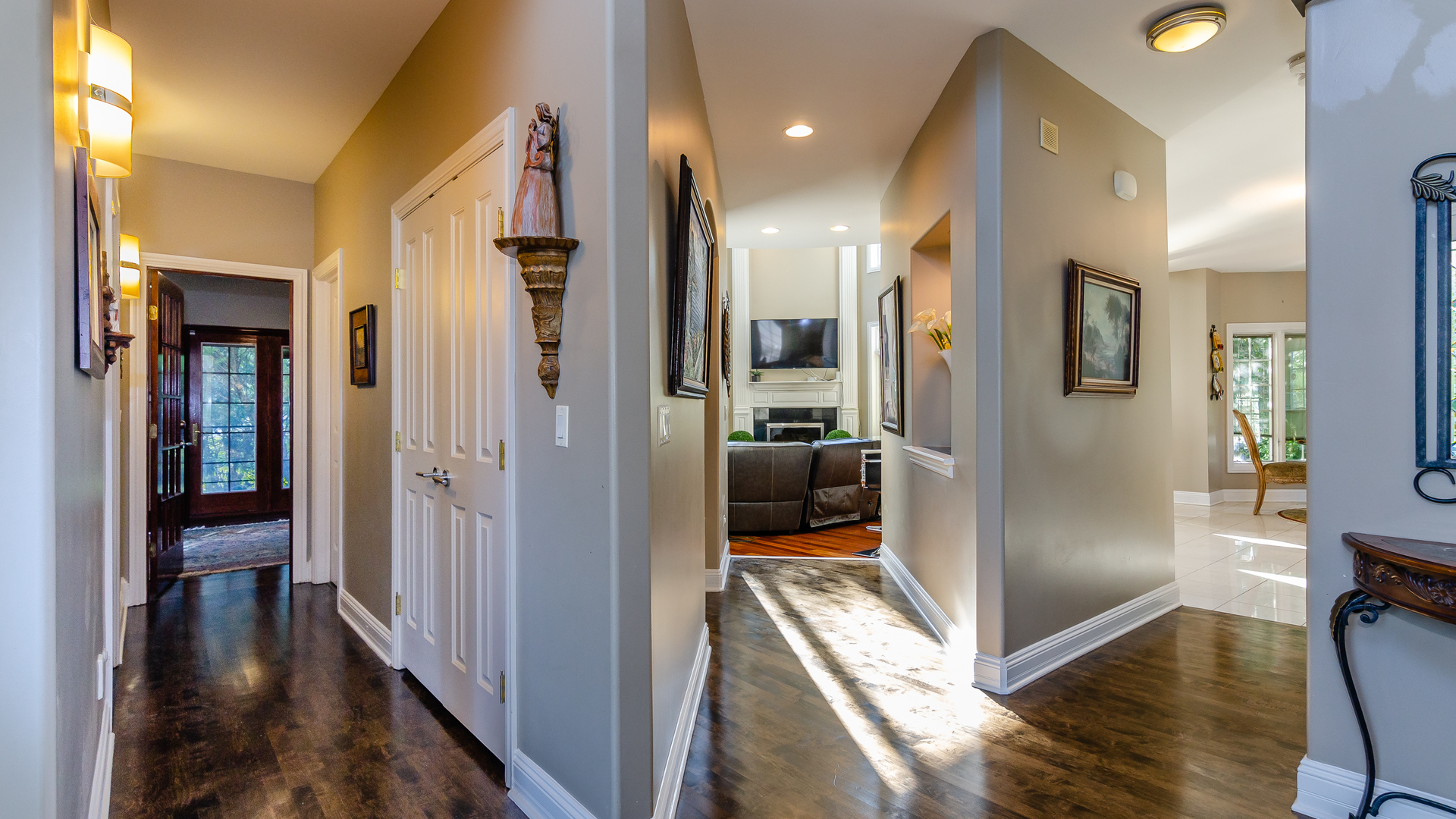 6919 Fieldstone Drive Burr Ridge, IL 60527 - Photo 7 of 58 a view of a hallway with wooden floor and a living room