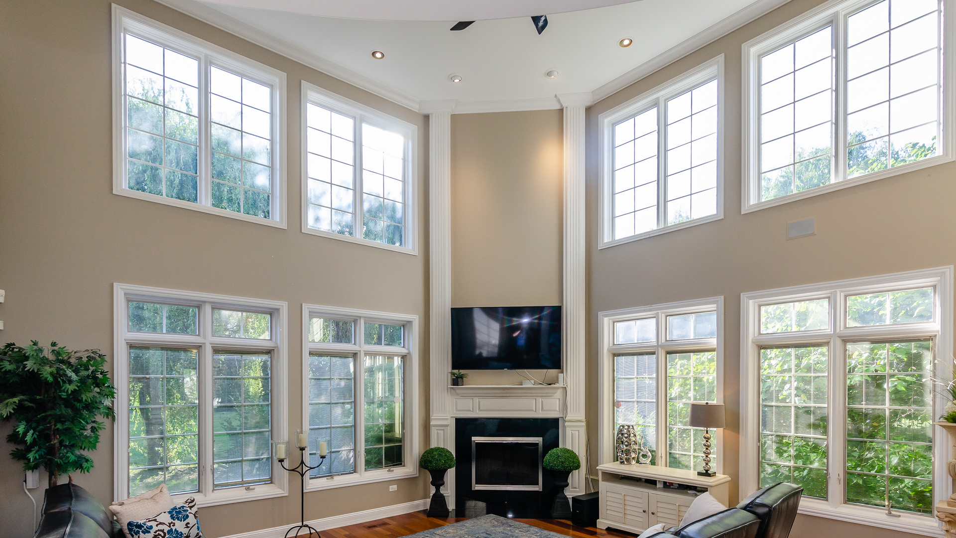 6919 Fieldstone Drive Burr Ridge, IL 60527 - Photo 8 of 58 a living room with fireplace furniture large windows and a flat screen tv