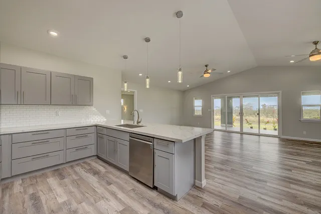 a kitchen with a sink and cabinets