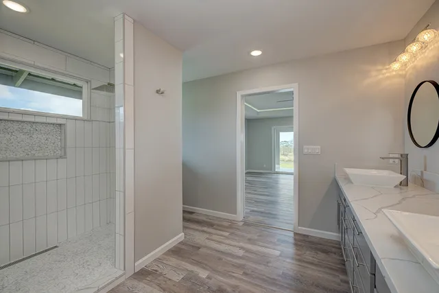 a bathroom with a sink and mirror