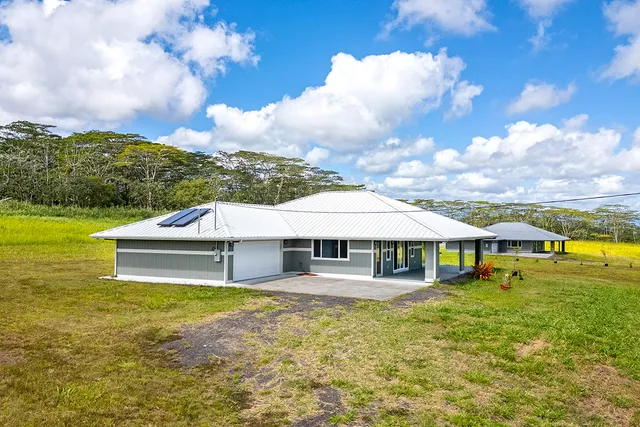 a small swimming pool with outdoor seating and yard