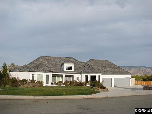 1319 Wolf Run Road Reno, NV 89511 - Photo 1 of 9 a front view of residential houses with street