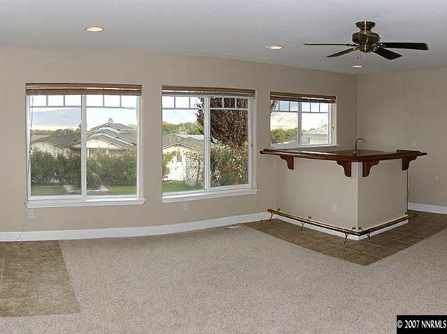 1319 Wolf Run Road Reno, NV 89511 - Photo 3 of 9 a view of a livingroom with a ceiling fan and window