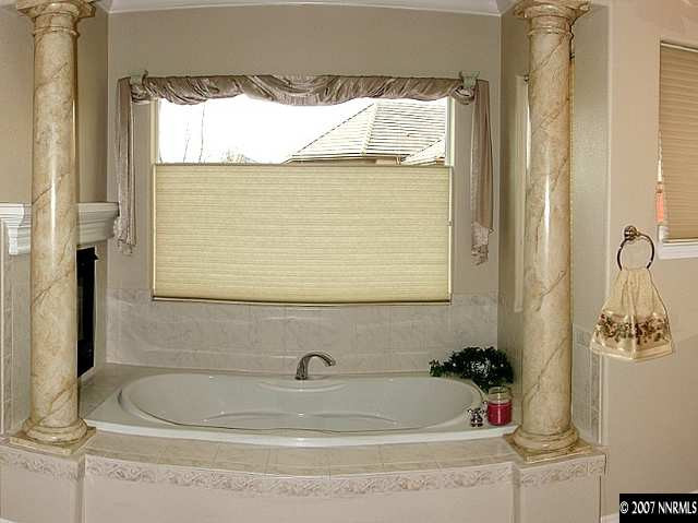 1319 Wolf Run Road Reno, NV 89511 - Photo 6 of 9 a bath tub sitting next to a window