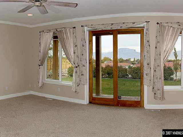 1319 Wolf Run Road Reno, NV 89511 - Photo 7 of 9 a view of room with window and a ceiling fan