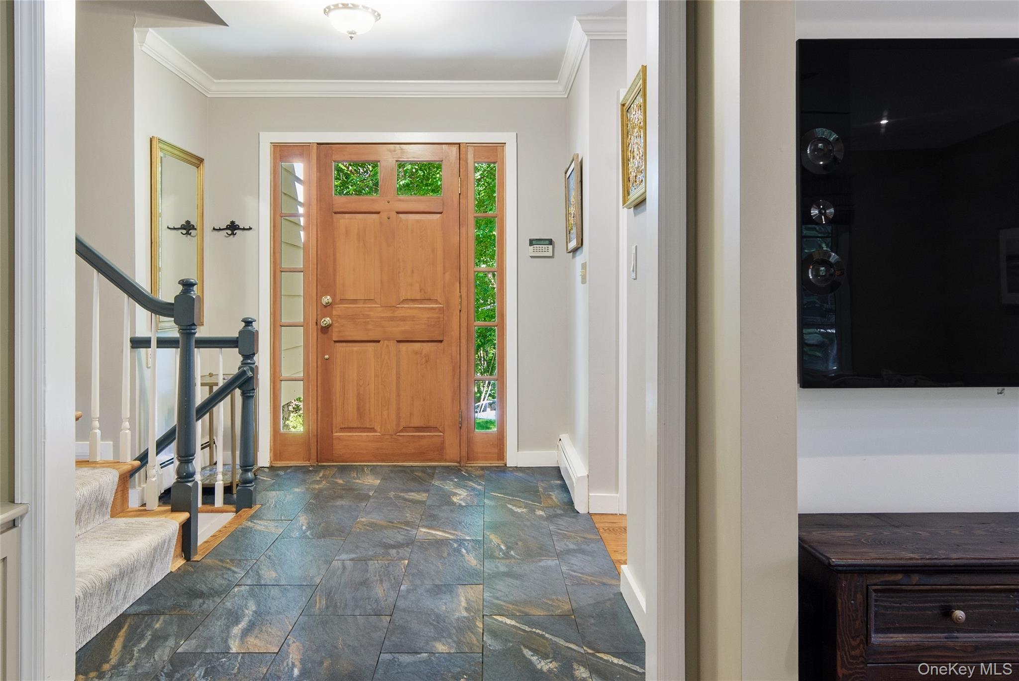 105 Cross Ridge Road Chappaqua, NY 10514 - Photo 10 of 43 Crown molding, 12 x 24 floor tile, and entry door with sidelights