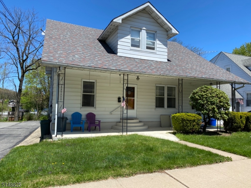 31 Dell Avenue, Unit B Netcong, NJ 07857 - Photo 3 of 6 a front view of a house with a garden