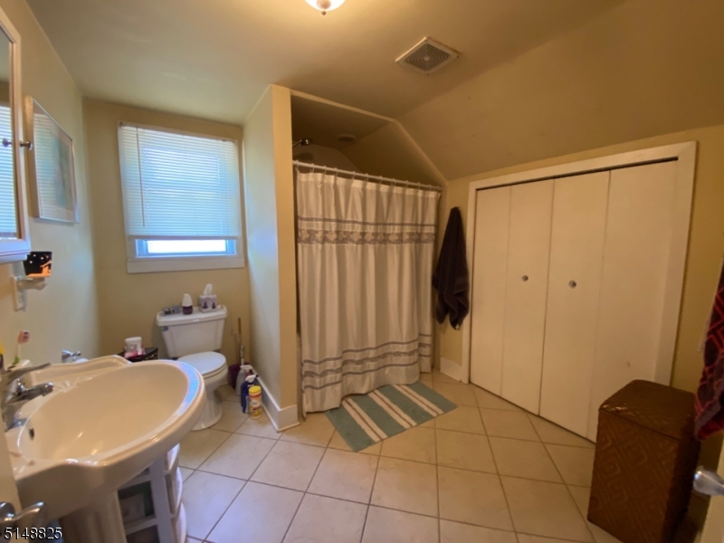 31 Dell Avenue, Unit B Netcong, NJ 07857 - Photo 4 of 6 a bathroom with a sink and a mirror