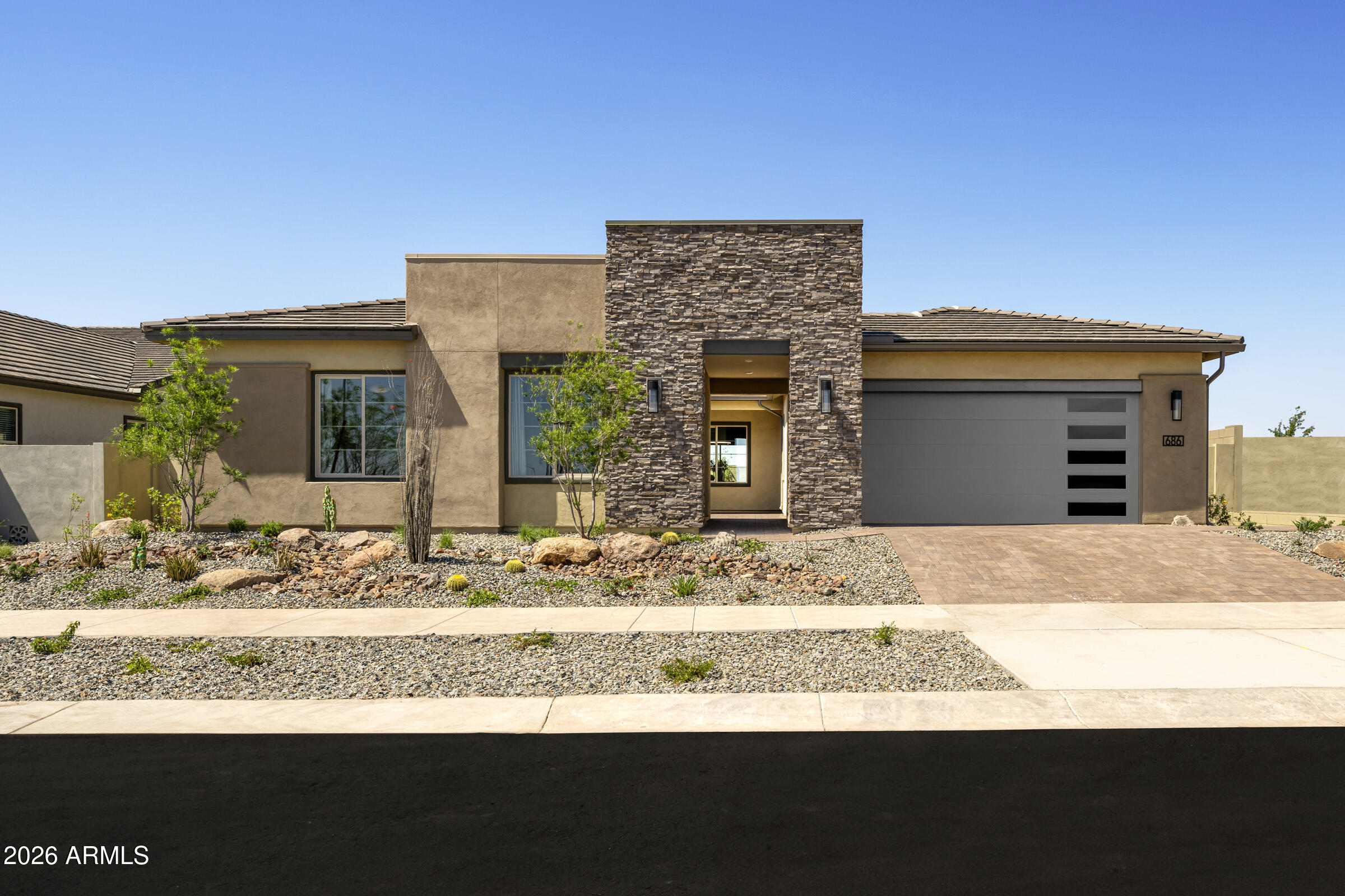 686 West Treasure Trail Apache Junction, AZ 85120 - Photo 1 of 15 a front view of a house with a porch