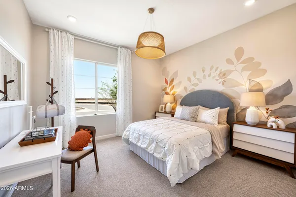 a bedroom with bed and a window