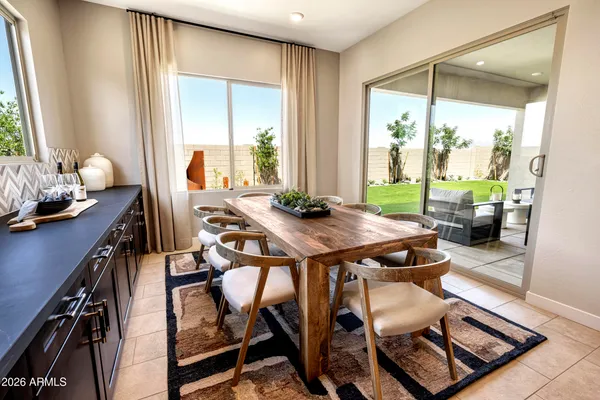 a view of a dining room with furniture window and outside view