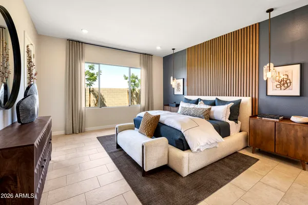 a bedroom with furniture and a large window