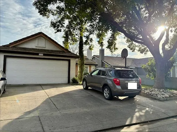 a car parked in front of a house