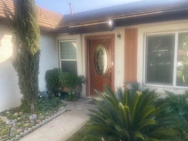 a front view of a house with garden