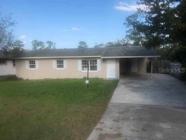 59 Alicante Road DeBary, FL 32713 - Photo 1 of 1 a front view of house with yard and trees