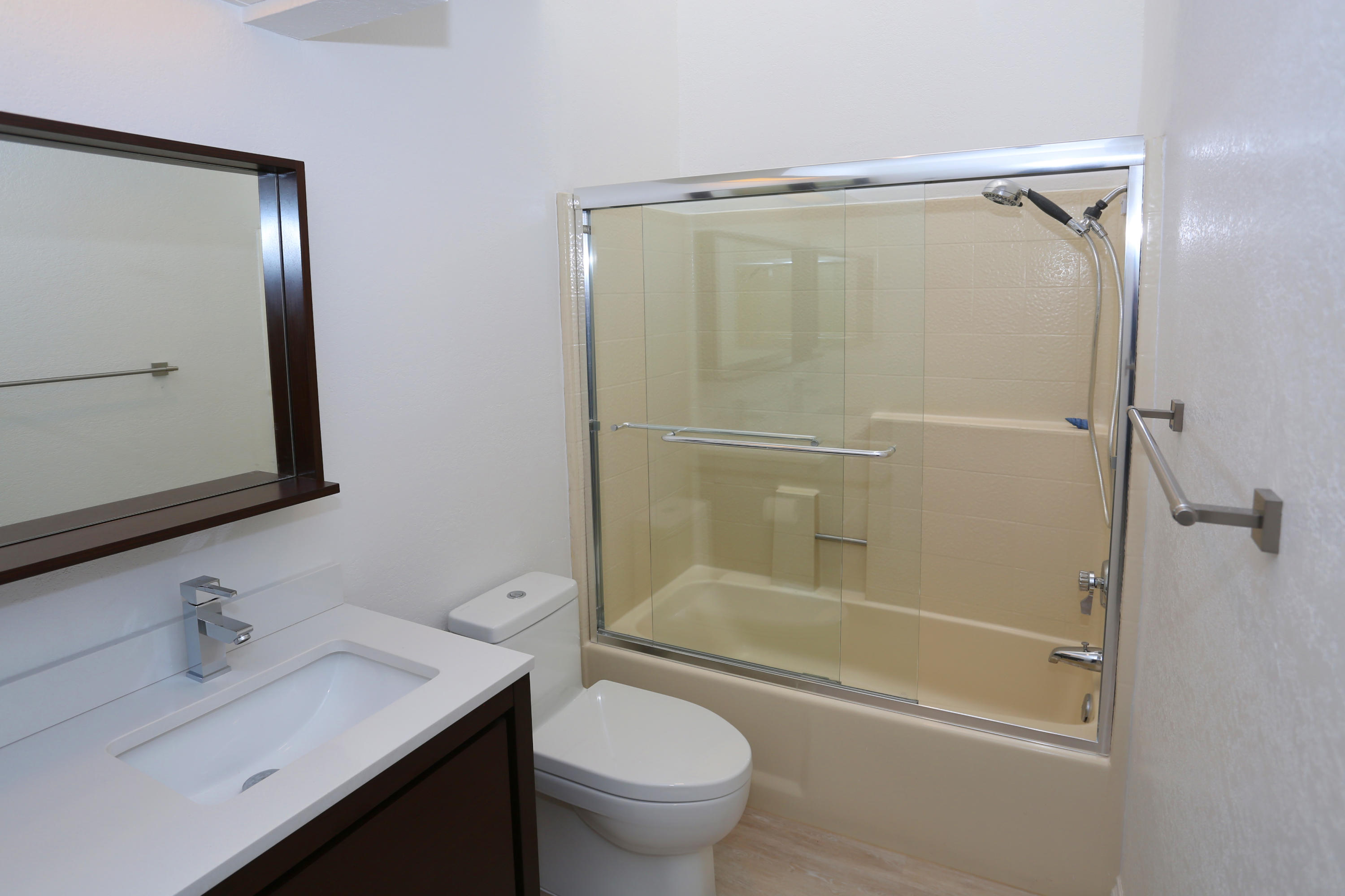 4040 Primavera Road Santa Barbara, CA 93110 - Photo 14 of 18 a bathroom with a granite countertop sink toilet and shower