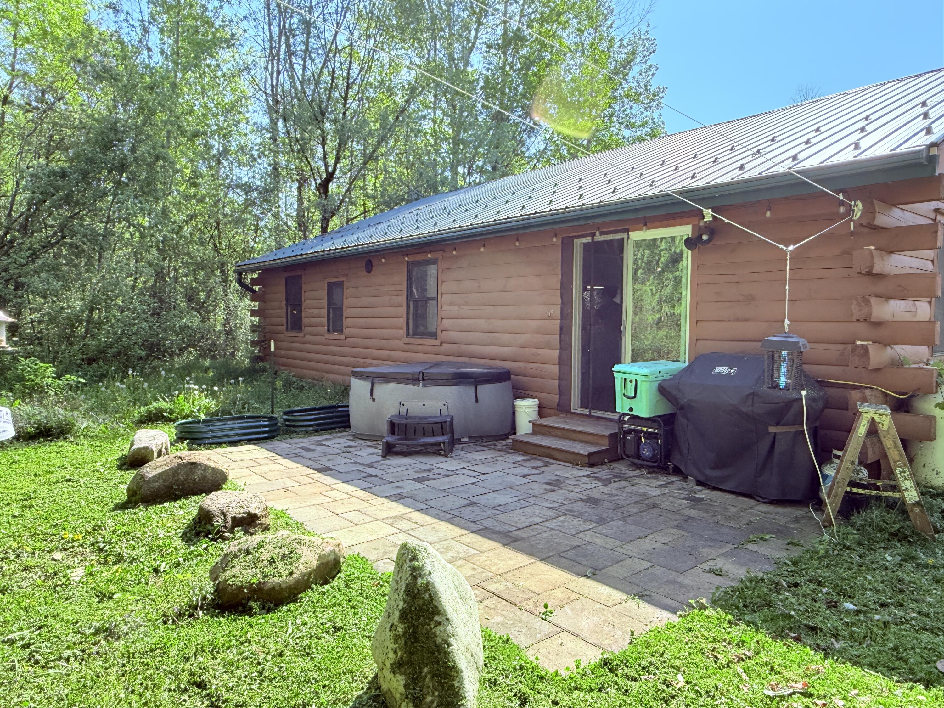 409 Butler Road Plattsburgh, NY 12901 - Photo 19 of 20 Relax out on the patio and enjoy the pond.