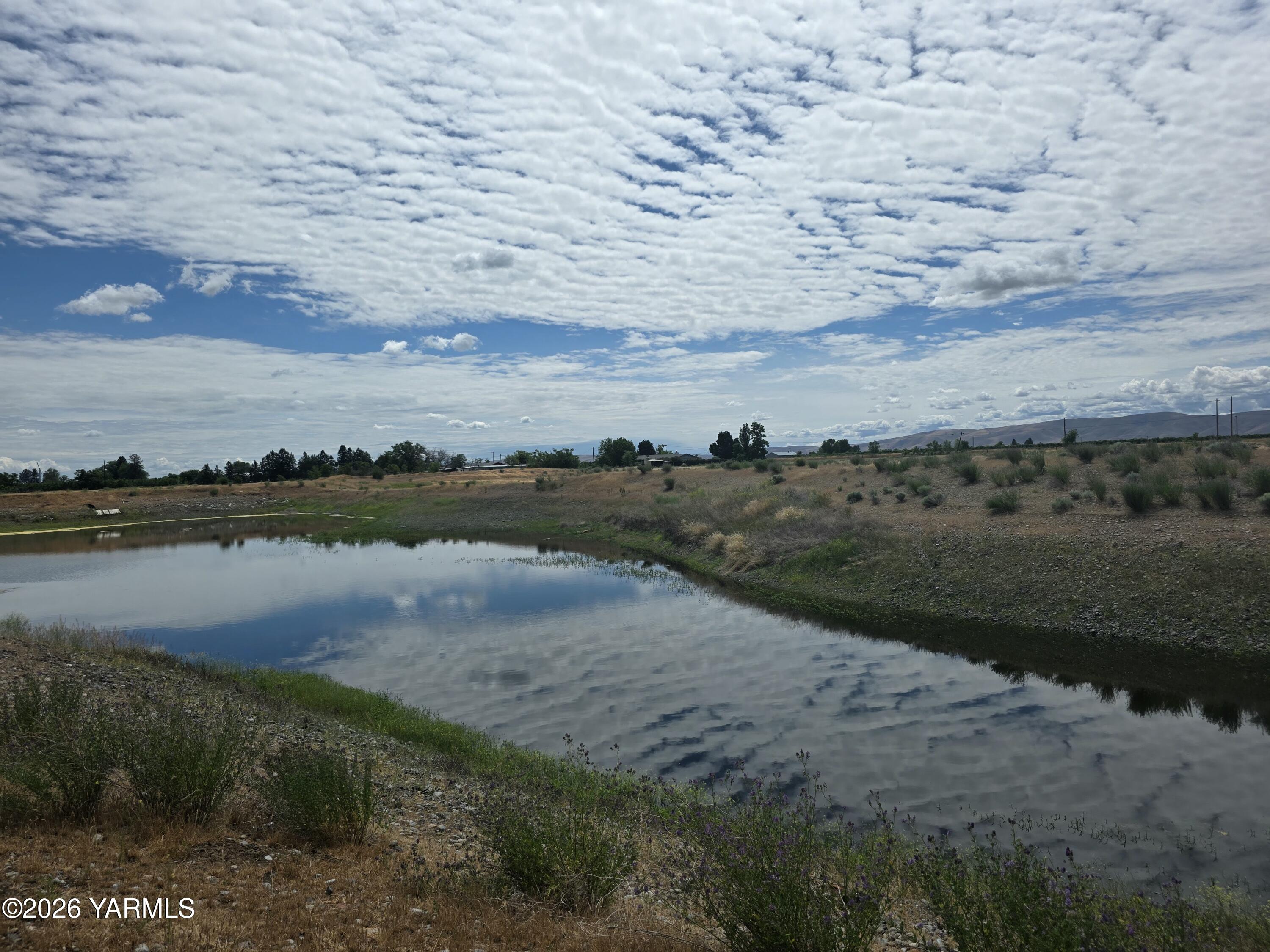 5451 Branch Road Wapato, WA 98951 - Photo 3 of 9 a view of a lake with an outdoor space