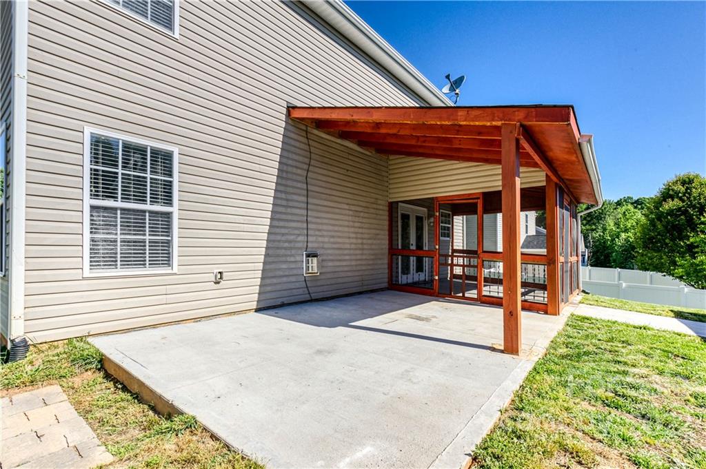 722 Overlook Road Lowell, NC 28098 - Photo 20 of 22 a view of a house with a backyard