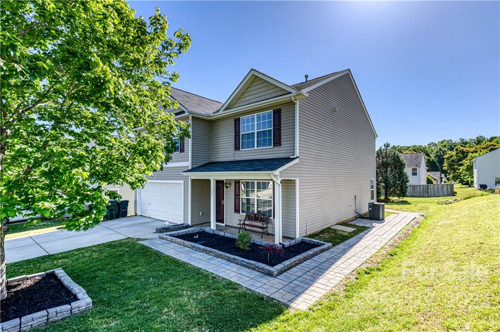 722 Overlook Road Lowell, NC 28098 - Photo 2 of 22 a front view of house with yard and green space