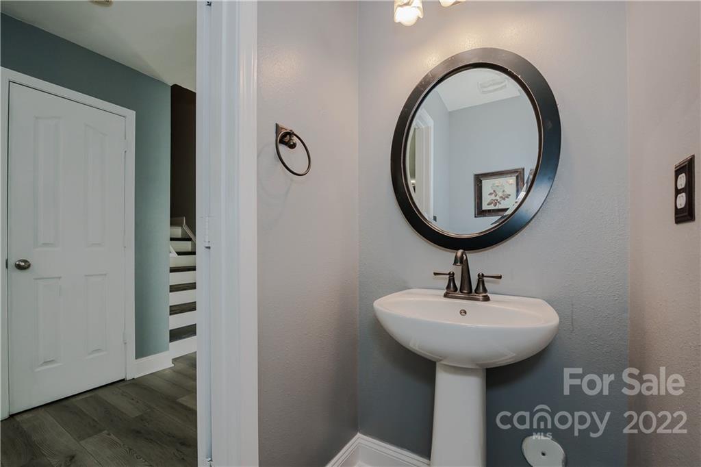 722 Overlook Road Lowell, NC 28098 - Photo 9 of 22 a bathroom with a sink and a mirror