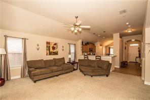 1409 Rosson Road Little Elm, TX 75068 - Photo 31 of 34 Spacious living area featuring vaulted ceilings, ceiling fan, and carpet flooring
