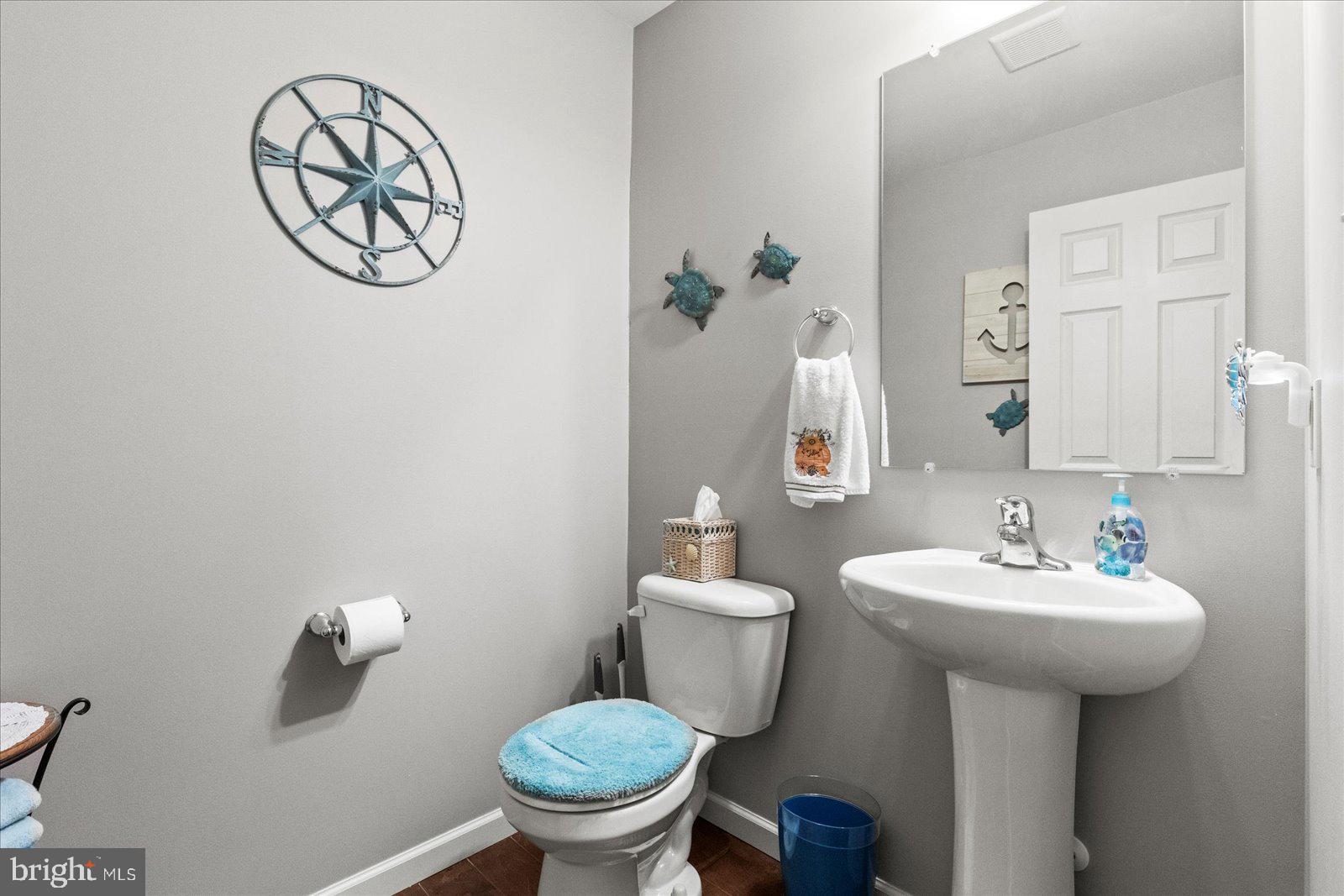 555 Countryside Road Seven Valleys, PA 17360 - Photo 11 of 56 a bathroom with a sink toilet and a mirror