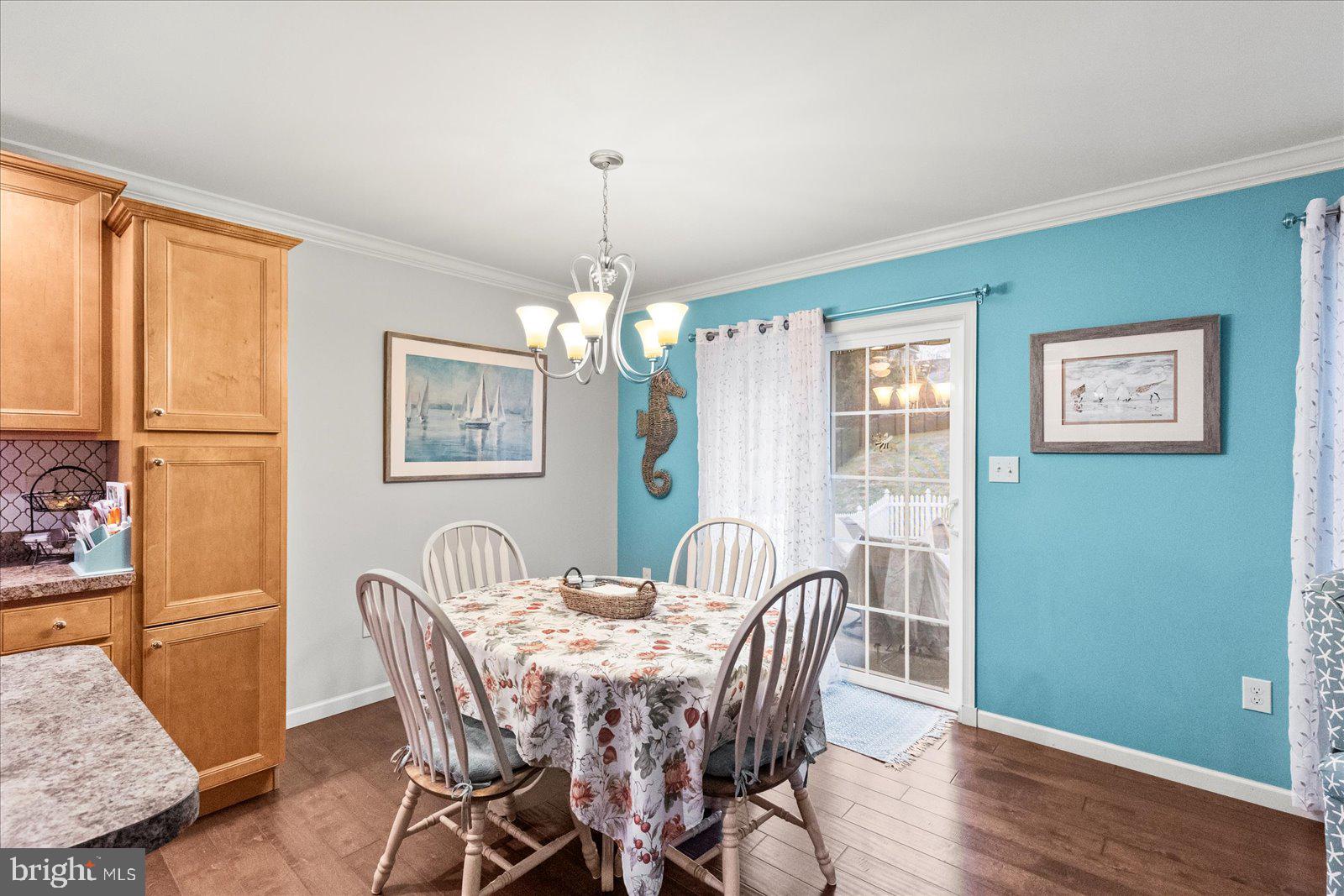 555 Countryside Road Seven Valleys, PA 17360 - Photo 18 of 56 a view of a dining room with furniture window and wooden floor