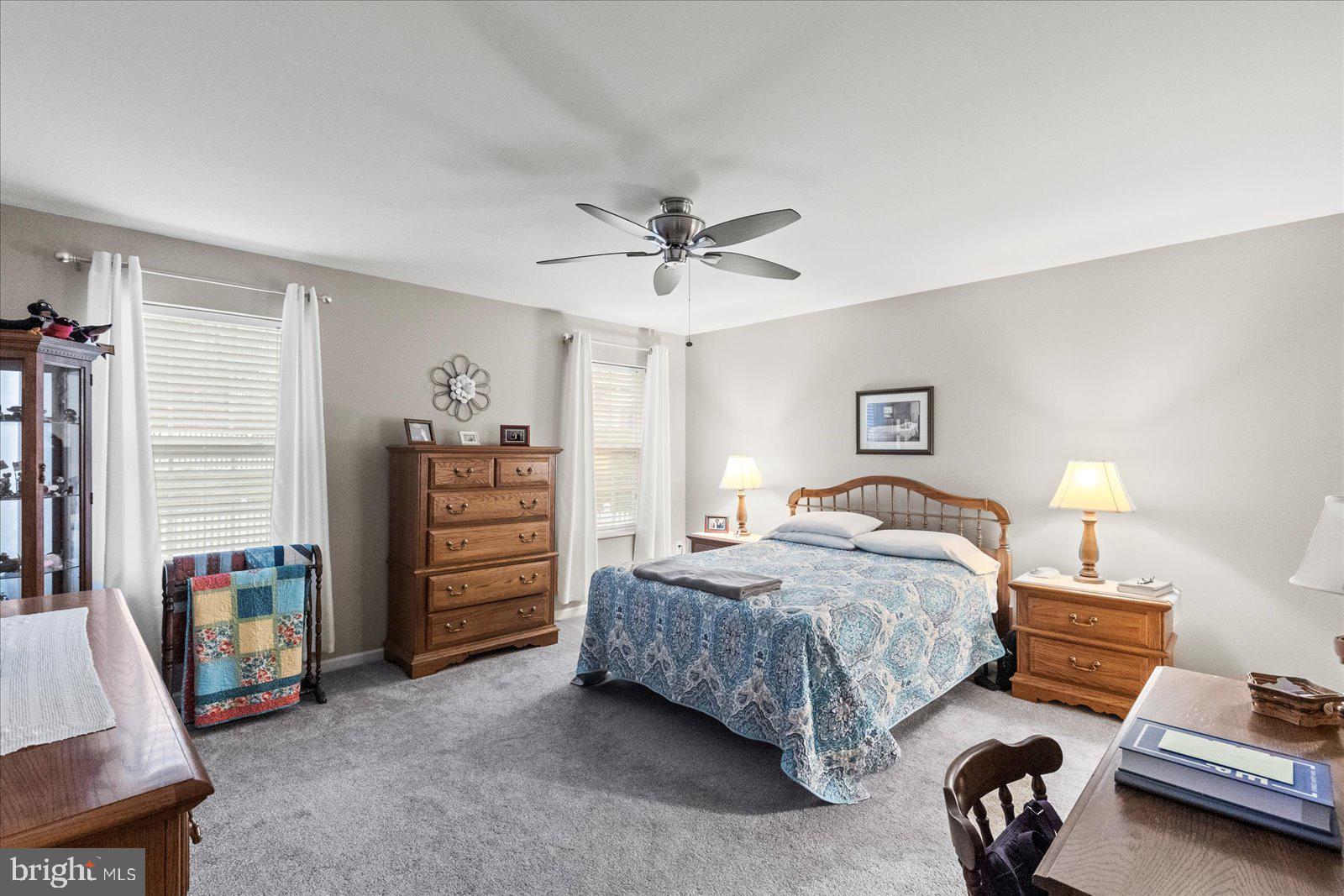 555 Countryside Road Seven Valleys, PA 17360 - Photo 20 of 56 a bedroom with bed and a chandelier