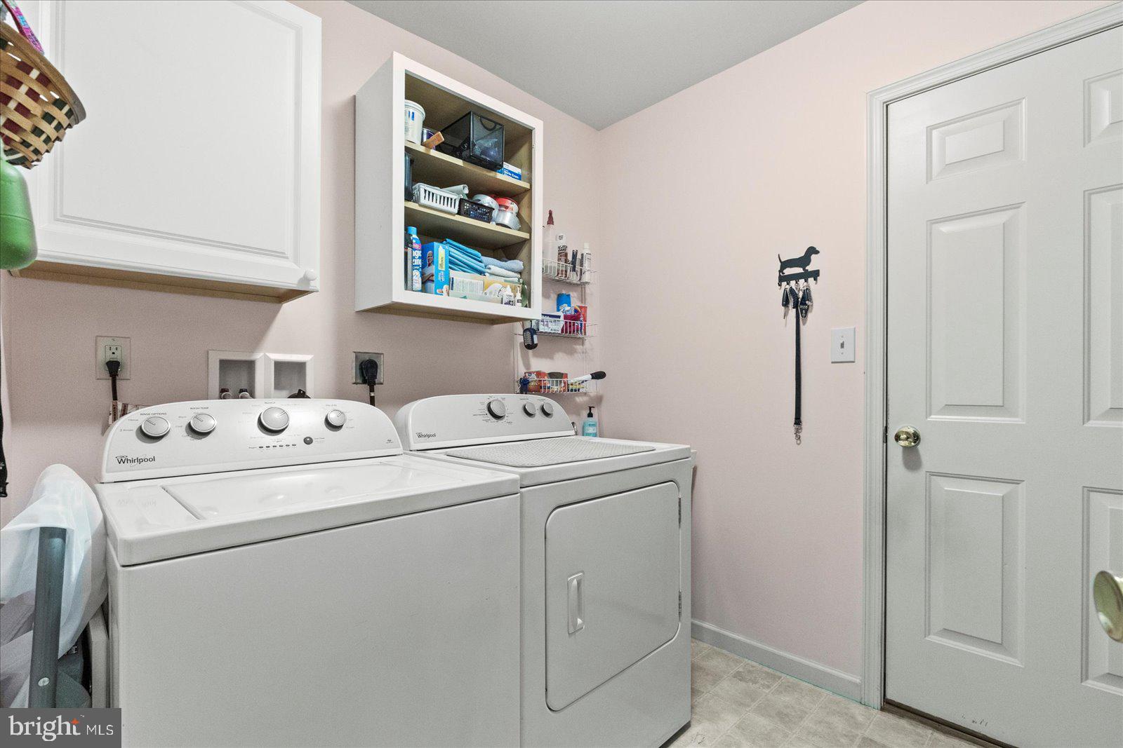 555 Countryside Road Seven Valleys, PA 17360 - Photo 10 of 56 a utility room with dryer and washer
