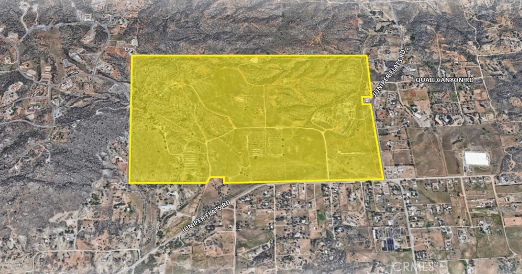 a view of a big yard with an outdoor space