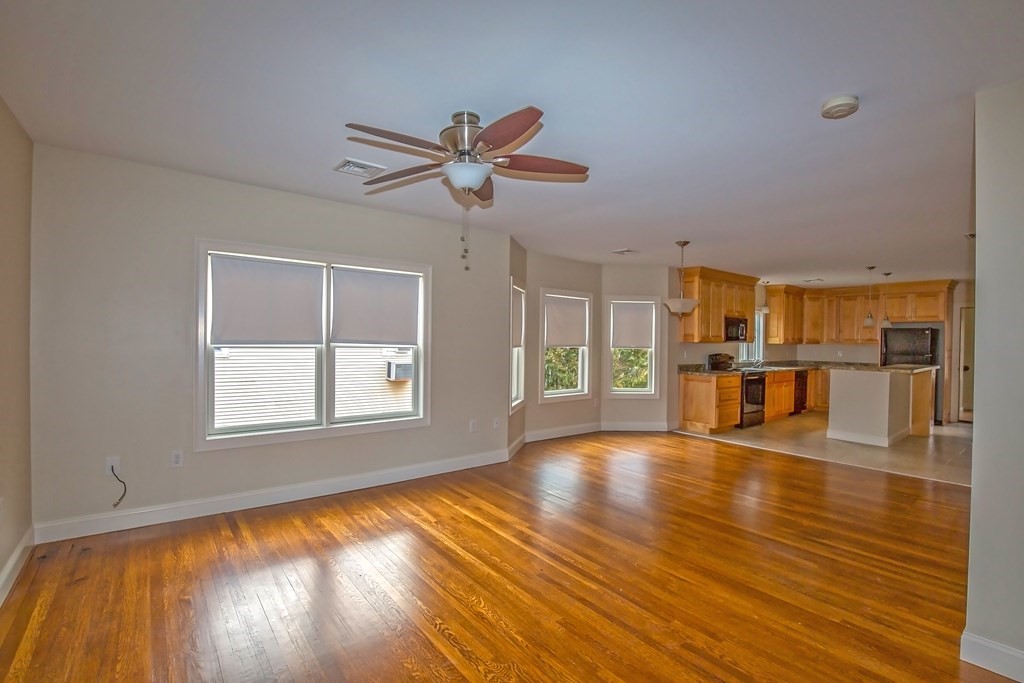 21-23 Piper Road West Springfield, MA 01089 - Photo 32 of 42 a view of an empty room with wooden floor and a window