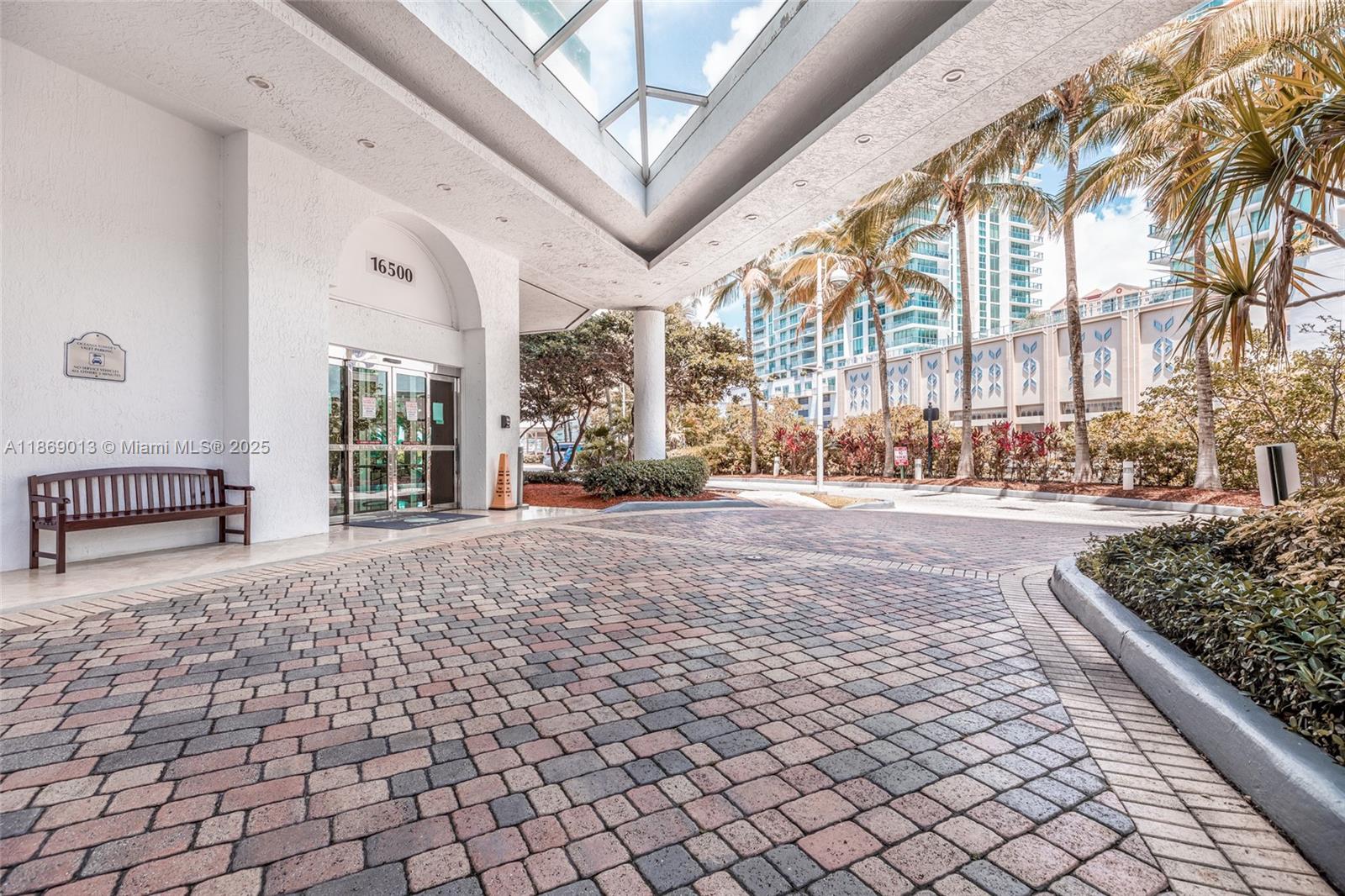 16500 Collins Avenue, Unit 655 Sunny Isles Beach, FL 33160 - Photo 2 of 48 a view of a pathway along a building