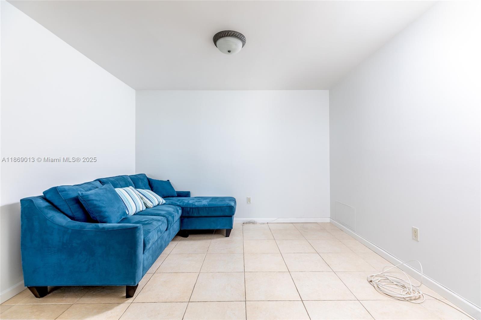 16500 Collins Avenue, Unit 655 Sunny Isles Beach, FL 33160 - Photo 34 of 48 a living room with furniture and a rug