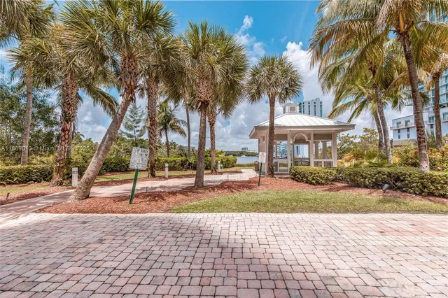 a view of a yard with palm trees
