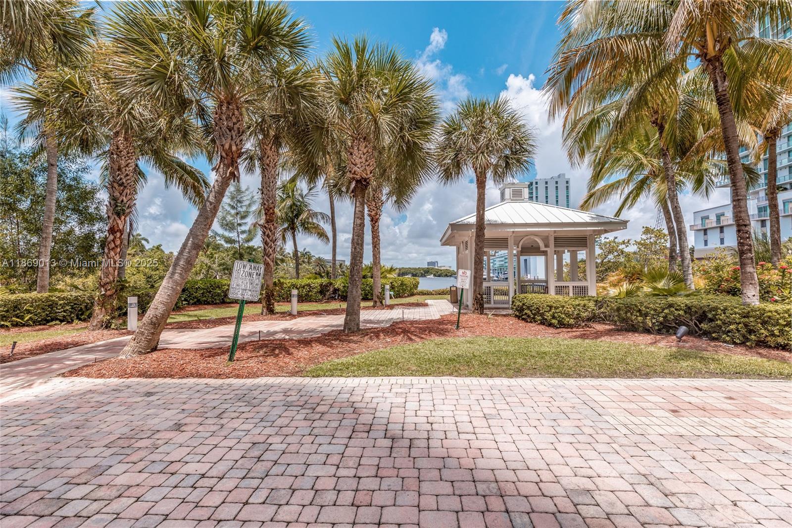 16500 Collins Avenue, Unit 655 Sunny Isles Beach, FL 33160 - Photo 4 of 48 a view of a yard with palm trees