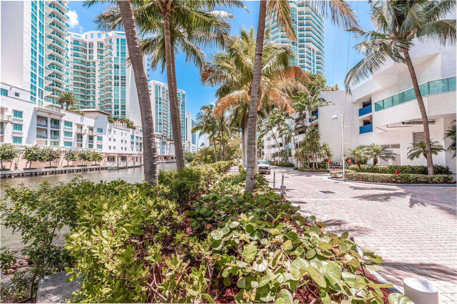 16500 Collins Avenue, Unit 655 Sunny Isles Beach, FL 33160 - Photo 5 of 48 a view of a garden with a house