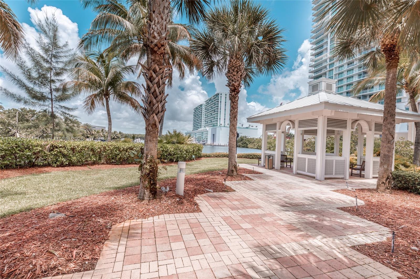 16500 Collins Avenue, Unit 655 Sunny Isles Beach, FL 33160 - Photo 6 of 48 a view of a house with a yard and tree s