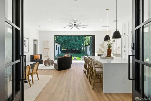 a view of a living room with furniture window and wooden floor