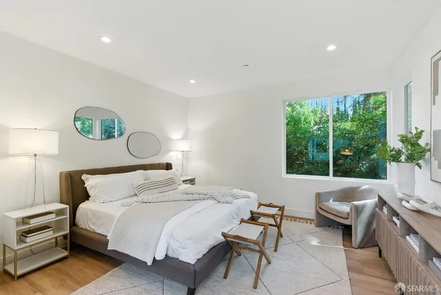 a bedroom with a bed and a couch