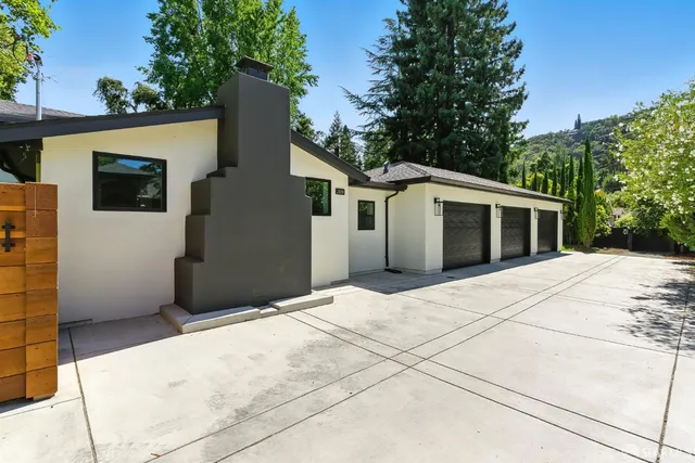 a front view of a house with garage